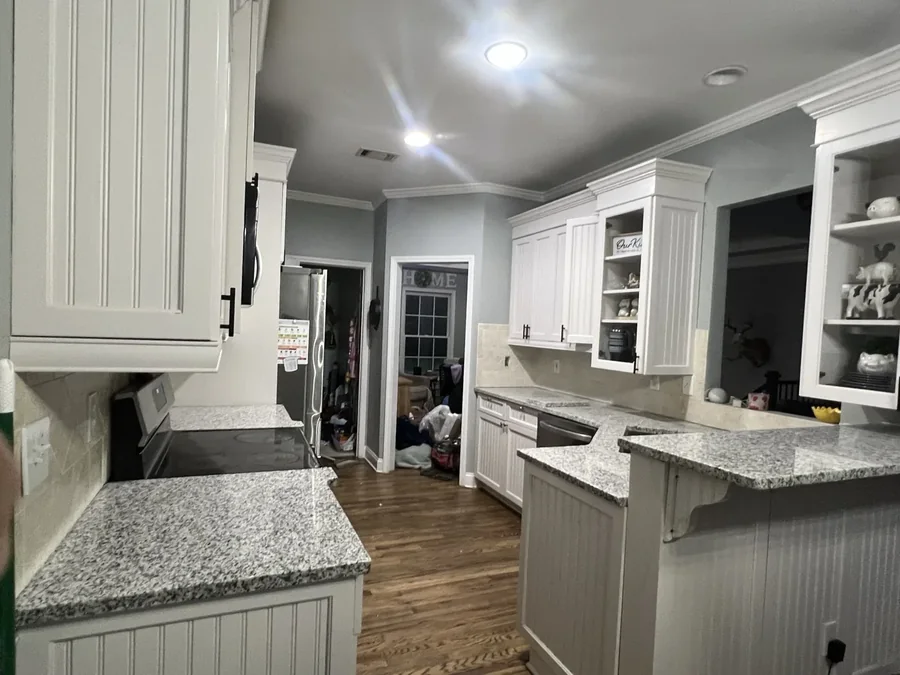 Granite counters against white shaker cabinetry