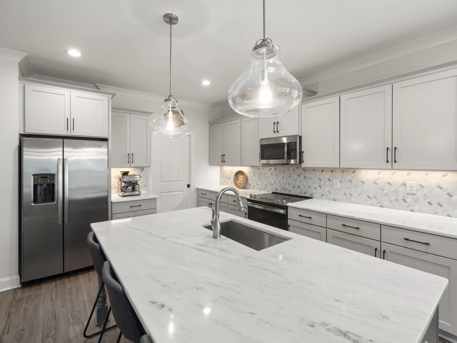 Marble island in a light grey modern kitchen