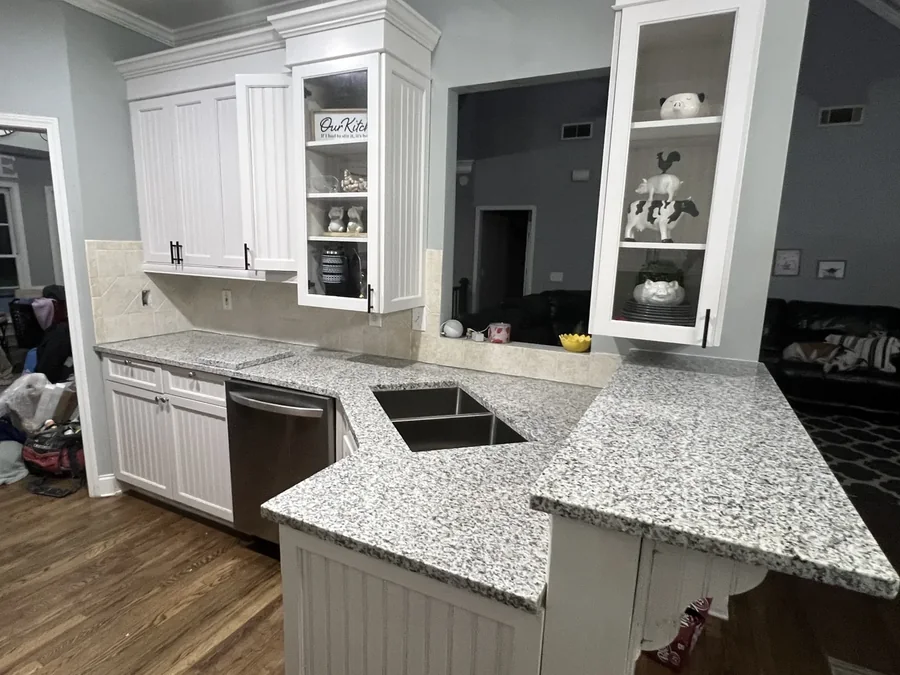 Veined quartz peninsula with seating overhang