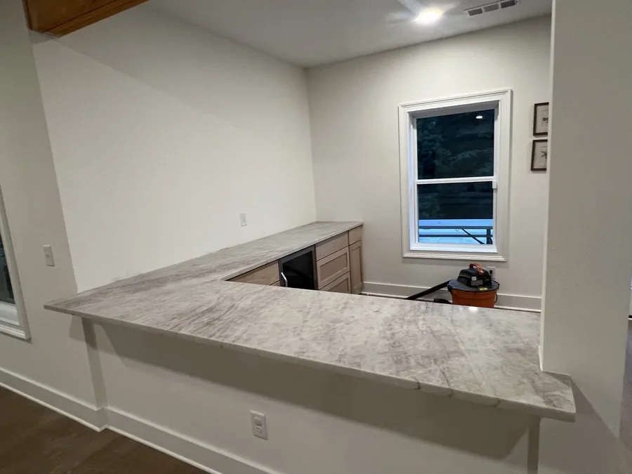 Home bar finished in veined quartz